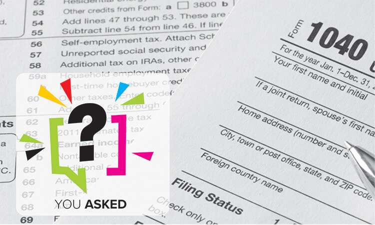 A stack of tax forms is used to illustrate the concept of tax deductions available to massage therapists.